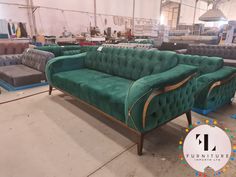 green velvet couches and chairs in a warehouse