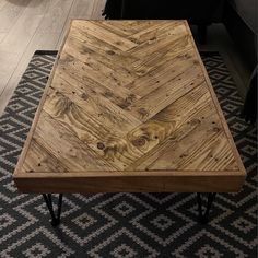 a coffee table made out of wooden planks