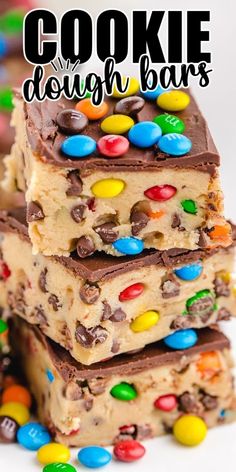 three pieces of cookie dough bars stacked on top of each other with m & m candies