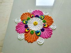 a colorful flower design is on the floor