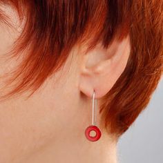 "Luscious bright cherry red glass enamel kiln-fired onto a copper O-ring shape suspended by a slender yet sturdy wire of sterling silver. A charming style that you can dress up or down. These earrings are feather-light! The overall length of the earrings is 1-1/8\" (3 cm). The powdered glass enamel is kiln-fired onto a copper disc 3/8\" (10mm) in diameter. The sterling earwire is hard soldered onto the enameled copper disc. I include a pair of clear rubber earhook \"keepers\" with all earrings, Minimalist Red Round Earrings, Red Round Enamel Earrings, Red Enamel Round Earrings, Red Drop Earrings For Everyday Wear, Red Circular Jewelry For Gifts, Modern Red Round Earrings, Red Circle Jewelry For Gift, Nickel-free Red Earrings For Everyday, Red Nickel-free Earrings For Everyday Wear