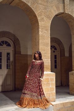 Pakistani Bridal Dress in Farshi Lehenga Kameez Style is a heavily embellished attire adorned with Goldwork and Floral designs. Dabka, Threads, Tilla, and embroidery make this stunning Lehenga Dress an epitome of beauty and your foremost priority for the wedding. Lehenga Kameez: The stunning kameez in an alluring red color is beautifully embellished with the intricate zardosi and shimmering silver gold work. Dabka, embroidery, threads, sequins, and motifs make this red kameez a perfect choice to wear on the big day. Intricate design on the kameez give it a flawless finishing look. Bridal Lehenga: The embellished kameez is paired with Bridal Lehenga, creating a lavish Pakistani Bridal Outfit. The Farshi Lehenga has an alluring contrast of red and orange shade and is gracefully emblazoned wi Farshi Lehenga, Zardosi Lehenga, Lehenga Kameez, Kameez Style, Bridal Lehenga Pakistani, Dabka Embroidery, Pakistani Bridal Lehenga, Lehenga Dress, Pakistani Bridal Dress