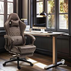 an office chair sitting on top of a wooden floor next to a desk with a computer monitor