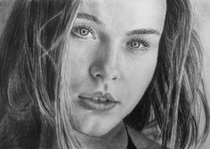 a pencil drawing of a woman with long hair