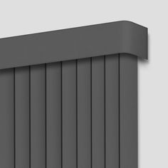 an image of a grey wall with vertical blinds