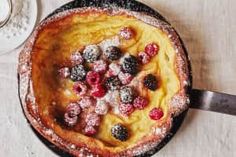 a pan filled with food sitting on top of a table