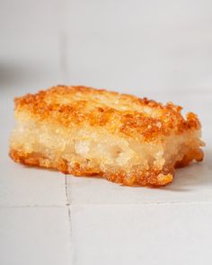 a piece of food sitting on top of a white counter