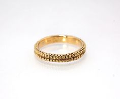 This is cast from a granulated original and is pictured in 14k yellow gold, but I can also cast this in Sterling or 18k yellow. Or would be happy to make a similar design for you in original 18k granulation!Granulation is a controlled fusing process that has been utilized for thousands of years. This unique surface will get more interesting with wear. The granules are individually placed and fused with a mouth torch. I then make a mold of the ring and pull a wax copy from that mold and cast it u Cast Band, Rings Rings, Lost Wax, Memento Mori, Ring Collections, Jewelry Handmade, Yellow Gold Rings, Handmade Silver, Ring Earrings