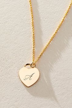 Just as effortless as it is elegant, this stunning necklace features a heart-shaped pendant with gorgeous cursive engraved initial for the ideal finishing touch. * 14k Gold Filled wheat chain * Personalized, laser engraved, 14k Gold Filled 12x14mm heart charm * Length: 18" * 5 days of production | Set & Stones Personalized Alice Necklace at Free People in Gold Elegant Nameplate Jewelry With Heart Charm, Elegant Heart Charm Nameplate Necklace, Elegant Necklace With Heart Charm And Nameplate, Elegant Necklaces With Heart Charm And Nameplate, Elegant Nameplate Heart Necklace For Gift, Elegant Nameplate Heart Necklace Gift, Gold Heart Necklace As Personalized Gift, Elegant Initial Pendant Necklace As Gift For Her, Elegant Silver Heart Pendant Initial Necklace