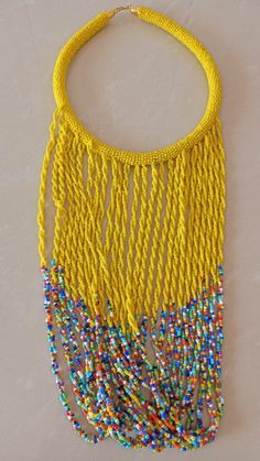 African Fringe Necklace, African Beaded Jewelry, Yellow Beaded Necklace, Tribal Jewelry, Women Necklaces, Mothers Gift, Chunky JewelryThis multi strand necklace is superbly crafted which makes you out stand in any occasion.Main Color - Yellow.Different colors are available.Feel free to send me a convo or e-mail for any clarification or more information.Thank you for visiting, Yellow Beaded Necklace With Large Beads For Beach, Festival Bib Necklace With Large Round Beads, Yellow Beaded Chain Necklace For Festivals, Yellow Beaded Bib Necklaces With Round Beads, Yellow Polished Beads For Festivals, Yellow Round Beaded Necklaces For Festivals, Yellow Bohemian Beads For Party, Bohemian Yellow Beads For Party, Yellow Bohemian Beaded Necklaces For Party