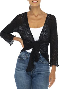 Pretty lightweight soft cotton knit shrug can be worn tied or untied for two fashion looks. Perfect over tops, camisoles, blouses and dresses. This feminine cardigan also provides upper arm coverage for sleeveless tanks and dresses A versatile year around shrug that looks fabulous with any outfit. Pair with shorts, jeans, skirts, sundresses or over swimwear. A comfortable sweater to toss in your bag for a night out or when traveling. 100% cotton is as pretty as it is practical Flattering ¾ lengt Shrug And Tank Top, Spring Knit V-neck Cover-up, Chic Knit Fitted Shrug, Versatile Fitted Wrap Cardigan, Chic Fitted Knit Shrug, Fitted Knit Shrug For Spring, Fitted Trendy Shrug For Summer, Trendy Fitted Shrug For Summer, Lightweight Fitted Casual Tops