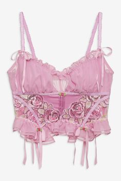 FOR LOVE & LEMONS FOR VICTORIA'S SECRET: For lovers of Coquette Coreyou need to meet the Doreen pink bustier, an ultra-feminine bustier top with a ruched chiffon bust panel, organza sequin-trimmed rosettes, and ribbon bows throughout. Pair it with the matching Doreen Thong Panty. Party Coquette Corset With Underwire, Sleeveless Organza Corset, Summer Flirty Pink Corset, Organza Sleeveless Corset, Feminine Pink Corset With Sweetheart Neckline, Pink Party Corset With Ruffles, Pink Ruffled Corset For Parties, Party Underwire Nylon Corset, Underwire Nylon Corset For Parties