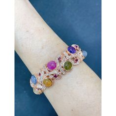 Bochic “Capri” Purple Amethyst & Multi Color Sapphires Cuff Set In 18K & Silver  Purple Amethyst - 3 Carats Blue Sapphire - 5 Carats Yellow Sapphire- 5 Carats Red Ruby - 5 Carats Light Blue Aquamarine - 3 Carats White Topaz - 2 Carats  The Bochic "Capri" Opal & Multi Fancy Gems Bracelet is Set in 18K Gold & Silver is a stunning piece of jewelry designed for versatility and elegance. Inspired by the artist and designer JAR. It features natural gems cabochons and brilliant cuts , showcasing pastel colors and pink tones. The Bracelet also includes natural multi-color fancy Gems. Crafted in 18K gold and 950 silver, this Bracelet is a combination of luxury and craftsmanship, It is ideal for transitioning from day to night, making it suitable for swimwear, caftans, or evening wear. The "Capri" c Luxury Multicolor Amethyst Gemstones, Luxury Multi-stone Cuff Bracelet Bangle, Luxury Multicolor Bangle For Formal Occasions, Gems Bracelet, Aquamarine Blue, Pink Tone, Red Ruby, Yellow Sapphire, 3 Carat