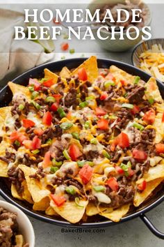 homemade beef nachos in a skillet with tortilla chips