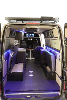 the inside of an empty van with blue lighting