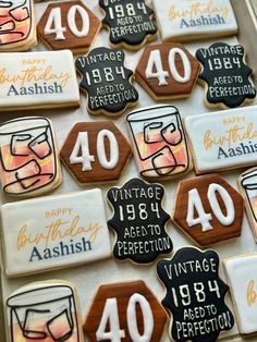 decorated cookies are arranged in the shape of forty and forty birthdays with glasses on them