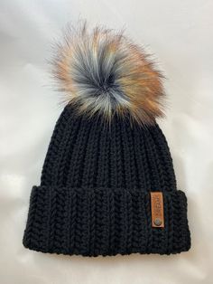 "This beanie is so warm and cozy! The adjustable brim allows for the hat to be worn fitted, or slightly slouchy. A modern, handmade rendition of the classic beanie Made with 100% acrylic, vegan friendly yarn.   This hat is designed to fit the average adult's 20\"-23\" head, although it is very stretchy and allows for a wide range of fits Hand wash recommended.  DO NOT put hats with pom poms in the dryer, they will burn.   *I try my best to capture the colors accurately in my photos, but please note that colors may vary slightly due to lighting and screen settings*" Cozy Adjustable Crochet Hat In Soft Knit, Adjustable Cozy Hats, Cozy Adjustable Hats, Cozy Adjustable One Size Hats, Warm Crochet Hat For Fall, One Size Fits Most, Adjustable Warm Bonnet For Fall, Cozy Crochet Hat For Fall, Adjustable Bonnet For Cold Weather In Fall, Adjustable Soft Knit Beanie Hat