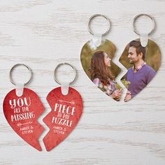 two heart shaped photo key chains with the words you got the missing piece on them