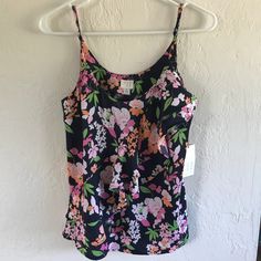 Adorable Floral Pattern With A Ruffle Design On The Front For Added Texture! Adjustable Straps. Brand New! It Is Navy Blue (Though The Pictures Look Black). Multicolor Floral Print Beach Camisole, Beach Floral Print Multicolor Camisole, Multicolor Floral Print Camisole For Beach, Beach Multicolor Floral Print Camisole, Summer Multicolor Floral Print Camisole, Ruffle Design, Spaghetti Strap Top, Strap Top, Strap Tops