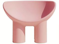 a pink chair sitting on top of a white floor