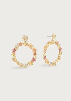 Epitomizing the beauty of a gathering of flowers, the Wildflowers Gathered Hoop Earrings are meticulously handcrafted from 18k gold-dipped brass, adorned with carefully selected colors of hand-painted enamel. A luxurious embodiment of sophistication, it effortlessly marries timeless elegance with a delightful sense of whimsy. 18K Gold Plated Brass Hand Painted Enamel Anabel Aram Signature Earring Backs 1.8" L x 1.5" W Gold Hoop Earrings For Spring Wedding, Spring Wedding Gold Hoop Earrings, Gold Floral Print Flower Earrings, Michael Aram Black Orchid, Black Orchid, Gold Dipped, Gift Card Shop, Bridal Shop, Earring Backs