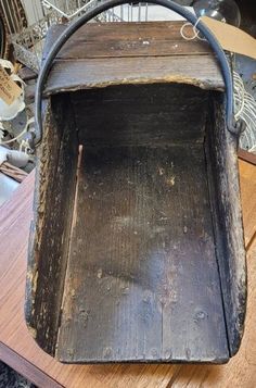 an old wooden box sitting on top of a table