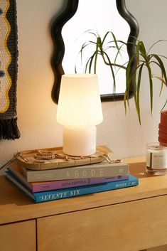 a lamp sitting on top of three books