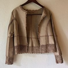 This Gorgeous Jacket Is In Nwot And By Suede Essentials (Leather Boutique). The Jacket Itself Is 100% Suede Leather With Rayon Lace/Patchwork Design. There Is Lace Trim On The Bottom And The Sleeves Hem/Front. It Is Button Down As Well. The Crochet Detail Is A Camel Color. The Leather Is In Excellent Condition. This Jacket Is A Very Unique And Bohemian Piece. Perfect For Fall Music Concerts. Professionally Leather Clean Only Spring Leather Jacket With Suede Overlays, Spring Leather Jacket With Patchwork And Long Sleeves, Spring Long Sleeve Leather Jacket With Suede Overlays, Elegant Patchwork Outerwear For Spring, Spring Brown Leather Jacket With Suede Overlays, Leather Jacket With Suede Overlays And Long Sleeves, Long Sleeve Patchwork Leather Jacket For Spring, Fall Leather Jacket With Patchwork, Spring Leather Jacket With Patchwork