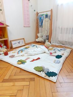 a child's room with wooden floors and white walls