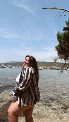 plus size woman wearing bikini and swim cover up on a beach in Split, Croatia