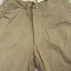 Vintage military work wear pants 1930-60s Size: M Inseam-24” Khaki Tapered Leg Work Pants With Belt Loops, Cotton Workwear Breeches With Belt Loops, Military Style Wide Leg Cotton Work Pants, Cotton Breeches With Pockets For Workwear, Military Style Cotton Pants With Welt Pockets, Vintage Cotton Cargo Pants With Belt Loops, Khaki Full-length Work Pants With Belt Loops, Vintage High-waisted Cotton Cargo Pants, Military Style Straight Leg Cotton Work Pants