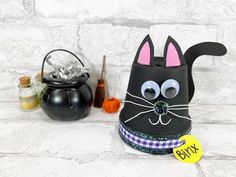 a black cat mask sitting on top of a table