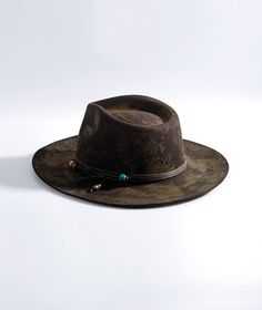 Embrace the rustic charm and contemporary style of our Beaded Strappy Distressed Fedora Hat. This hat is designed to add character to your look while keeping you comfortable and stylish. Add a touch of timeless elegance to your wardrobe with this one-of-a-kind accessory Beaded Strappy Accent: The beaded strappy design adds a touch of elegance and uniqueness, making this fedora hat ideal for making a statement. Distressed Finish: The distressed appearance adds character and a sense of vintage cha Handmade Adjustable Rustic Fedora, Rustic Distressed Brown Fedora Hat, Rustic Fedora Hat, One Size Fits Most, Rustic Brown Handmade Fedora, Western Brown Fedora With Woven Detail, Different Hat Styles, Hat Size Chart, Different Hats, Felt Beads