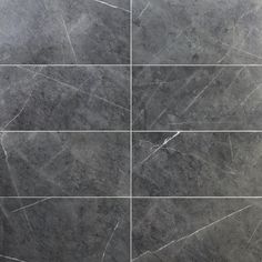 an image of marble tile that looks like it has been cut in four squares and is grey