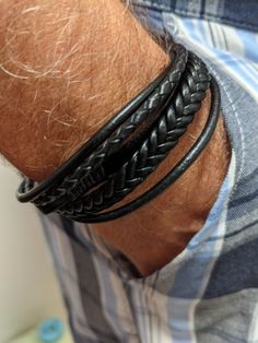 Fashion men's leather bracelet with magnetic closure, easy and simple to wear. Stylish men's accessory. A great gift for a guy who loves accessories. Colors: blue, black, brown. - Color: blue, black, brown - Gender: Male - Material: leather bracelet. - Pattern: Braided Leather. Masculine Leather Bracelet For Everyday, Masculine Leather Bracelet With Black Band, Father's Day Adjustable Leather And Stainless Steel Bracelet, Masculine Brown Leather Bracelet For Everyday, Masculine Adjustable Braided Bracelets With Leather Strap, Men’s Braided Leather Bracelet, Masculine Black Leather Bracelet With Stainless Steel, Recycled Fashion, Mens Leather Bracelet