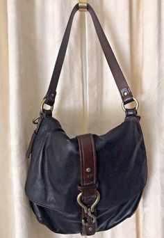 Cole Haan Soft Buttery Black Leather with brown trim satchel handbag Antique Brass details Magnetic snap closure Brown fabric liner in excellent shape Interior zipper pocket 14”W  x 12” H x 3”D Strap drop: 11” Longer add on strap not included Excellent shape from smoke & pet free home Hand References, Brown Leather Satchel, Leather Satchel Handbags, Brown Trim, Satchel Handbag, Brown Fabric, Satchel Handbags, Leather Satchel, Cole Haan