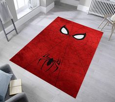 a red rug with a spiderman face on it in a living room area next to a chair