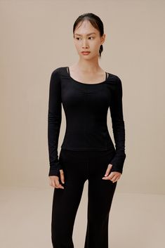 Let every motion flow as easy as your breath in this Ballet Longsleeve T-Shirt - tailored in a flexible, breathable blend to support & enhance your movement as you go through your dance or workout routine. This item is FINAL SALE and cannot be returned or exchanged. Details Materials & Care Shipping & Returns • Slim-fitting, comfortable, yet minimalist-chic design.• Durable, breathable nylon-Spandex fabric blend.• Designed for ballet/dance, yoga, or any activity. • Materials: 81% nylon, 19% Span Black Tops For Pilates With 4-way Stretch, Black Top For Pilates With 4-way Stretch, Black Tops With 4-way Stretch For Pilates, Versatile Black Tops With Thumbholes, Black Compression Tops With Thumbholes, Versatile Black Compressive Tops, Black Fitted Top For Pilates, Black Compressive Top For Pilates, Versatile Workout Tops With Minimal Stretch