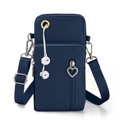 a blue cross body bag with silver hardware and heart decorations on the front, attached to a lanyard