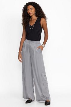 Crafted from a lightweight flowing fabric, the Cupro Pleated Pull On Pants add a stylish flare to a classic wide leg. Featuring an elastic waist and pleated detailing at the front, these wide-leg pants are finished with slant packets and cargo pockets for a unique twist. Pair with a fitted tank and sandals for a polished casual look. Johnny Was Women's Cupro Pleated Pull in Cloudburst Grey, Size Large Polished Casual, Flowing Fabric, Boho Chic Outfits, Women's Blouses, Chic Outfit, Embroidered Jeans, Bottom Clothes, Johnny Was, Pull On Pants