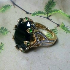 Like New. The Power Ring Fit For A Queen. Gold Over 925 Silver With Genuine Black Spinel And Vivid, Crisp Green Russian Diopside. Let This Be The Ring You Reach For Whenever You Need To Make A Statement Or Just Be Heard. Invest In Quality Jewelry That You Will Have Forever. Be Proud To Wear Or Give As A Gift. Be The Queen Who Gets This One. Truly Stunning And Beautiful From All Angles. Firm. Firm. Firm. Firm. Luxury Tsavorite Jewelry With Gemstone Accents, Elegant Tourmaline Cabochon Jewelry, Elegant Tsavorite Rings With Polished Finish, Elegant Tourmaline Jewelry With Accent Stones, Luxury Hallmarked Tsavorite Jewelry, Luxury Tourmaline Jewelry For Formal Occasions, Goth Ring, Power Ring, Black Spinel