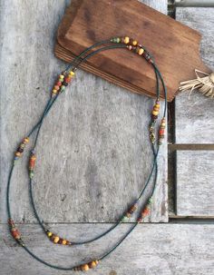 Bohemian Single Strand Lariat Beads, Bohemian Single Strand Lariat Beaded Necklaces, Bohemian Single Strand Lariat Beaded Necklace, Bohemian Beaded Chain Long Necklace, Bohemian Long Beaded Chain Necklace, Bohemian Lariat Jewelry With Tiny Beads, Bohemian Lariat Beaded Necklaces With Colorful Beads, Bohemian Long Necklace With Wooden Beads As A Gift, Bohemian Czech Glass Tiny Beads