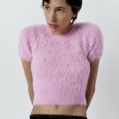 Fuzzy Cropped Top With Embellished Detail. Pink Winter Top For Night Out, Winter Pink Top For Night Out, Pink Top For Winter Night Out, Pink Tops For Night Out In Winter, Glamorous Embellished Top For Winter, Pink Fitted Tops With Rhinestones, Fitted Pink Tops With Rhinestones, Winter Embellished Tops, Chic Embellished Winter Tops