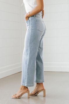 These trendy Light Wash Wide Leg Crop Jeans are a must-have for spring! Features a high rise waist, a wide leg silhouette, front & back pockets, a cropped length, and a button zip fly closure. Style them with a basic tank top or bodysuit along with strappy high heels for a chic day to night outfit! Be sure to complete the look with simple gold jewelry and a matching crossbody. Simple Gold Jewelry, Day To Night Outfit, Strappy High Heels, Gold Jewelry Simple, Crop Jeans, Night Outfits, Small Bust, Basic Tank, Cropped Jeans