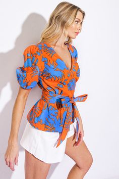 A printed woven top featuring short sleeve and true wrap with tiesDetails:Self : 100% CottonSize & Fit- Model is 5`8" And Wearing Size Small- Measurements Taken From Size Small- Approx. Length: 24" Luxe Boutique, Sweater Blazer, Boho Luxe, Tie Blouse, Short Sleeve Bodysuit, Woven Top, Denim Leggings, Blue Design, Sweater Blouse