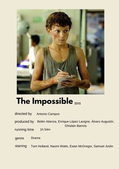 the impossible movie poster with an image of a young man looking at his cell phone