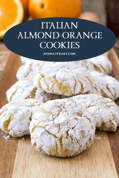 italian almond orange cookies on a cutting board with an orange in the background and text overlay