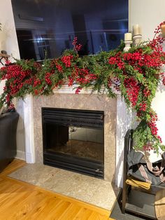 a living room with a fireplace decorated for christmas