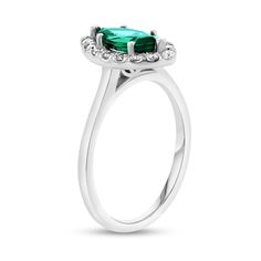 Top off your dressy looks with this marquise-cut green emerald and diamond frame ring, a timeless design that elevates your attire with ease. Created in 14K white gold The 10.0 x 5.0mm marquise-cut verdant-green emerald glistens in a frame of shimmering diamonds. Underneath the centerpiece, sculpted leaf-like marquise shapes add nature-inspired elegance to the style. This classic choice sparkles with 1/4 ct. t.w. of diamonds. Marquise Brilliant Cut Emerald Ring, Marquise Emerald Ring With Brilliant Cut, Emerald Diamond Ring For May Birthstone In Marquise Shape, Formal Diamond Ring With Halo For May Birthstone, Emerald Diamond Ring With Marquise Cut Center Stone, Green Marquise Brilliant Cut Rings, Formal Marquise Cut Emerald Ring, Formal Green Marquise Emerald Ring, Marquise Emerald Ring For Formal Occasions In May