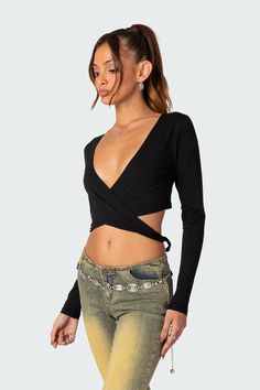 Layla Wrap Crop Top – edikted Stretch V-neck Crop Top For Night Out, Stretch Low-cut Tops For Summer, Trendy Fitted V-neck Long Sleeve Top, Stretch Low-cut Summer Tops, Fitted V-neck Top For Night Out, Stretch V-neck Long Sleeve Top For Summer, Summer Long Sleeve V-neck Top, Low-cut Crop Top For Spring Night Out, Low-cut Crop Top For Night Out In Spring